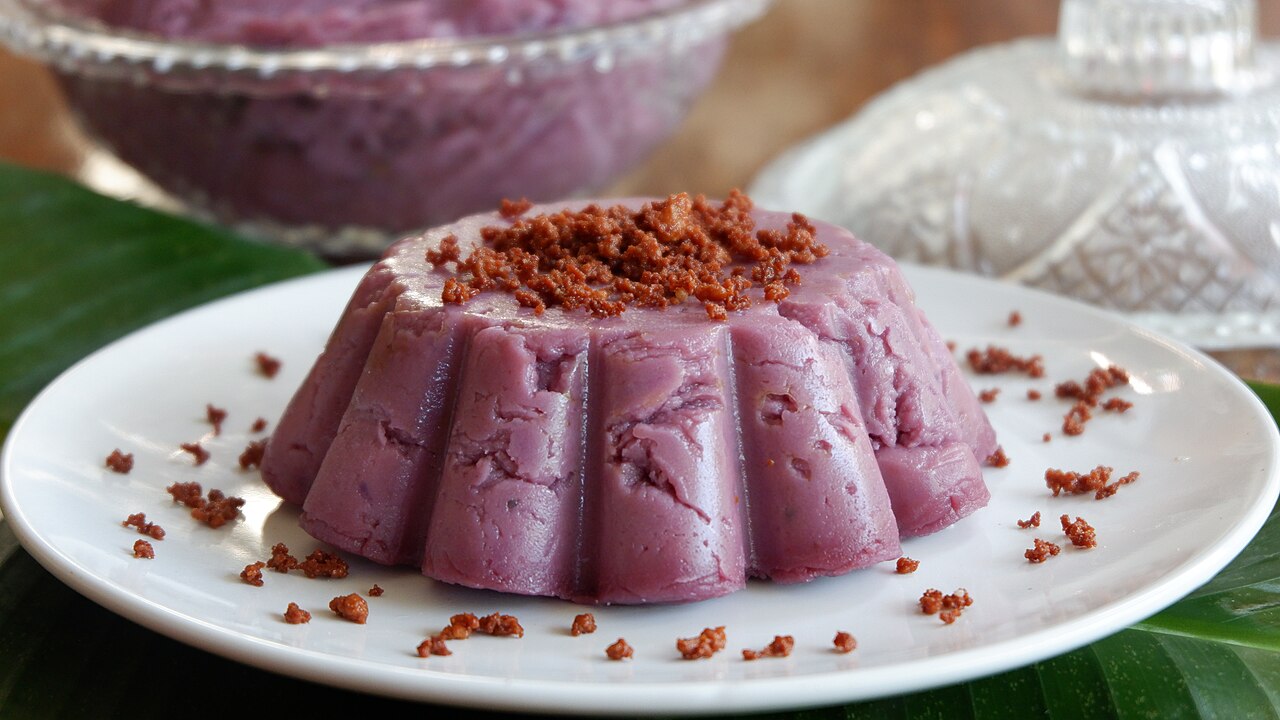 Ube halaya — a Filipino purple yam dessert topped with toasted coconut